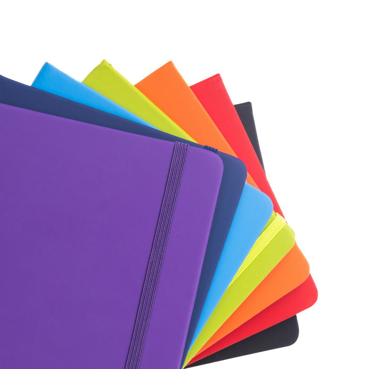 A bunch of different colored notebooks stacked on top of each other